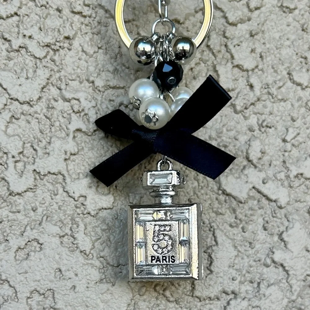 Luxe Silver Perfume Bottle Keychain/Bag Charm with Black Bow